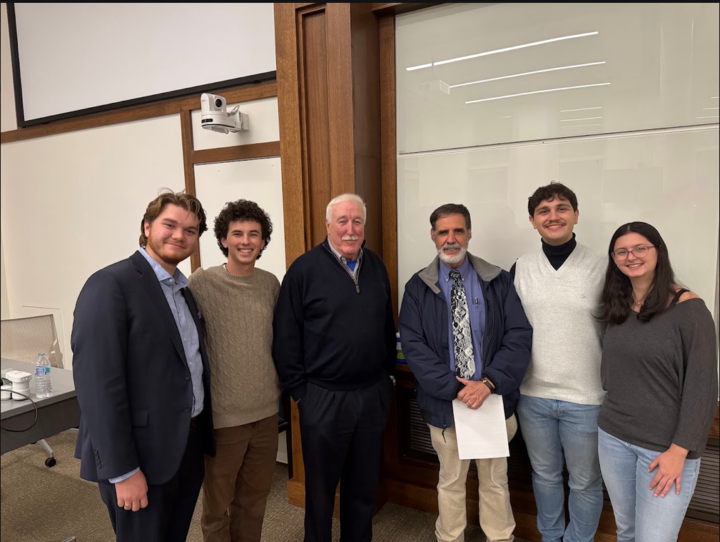 Sam with the Syracuse AIAA board, a faculty professor, and Sean O’Keefe at an AIAA guest talk